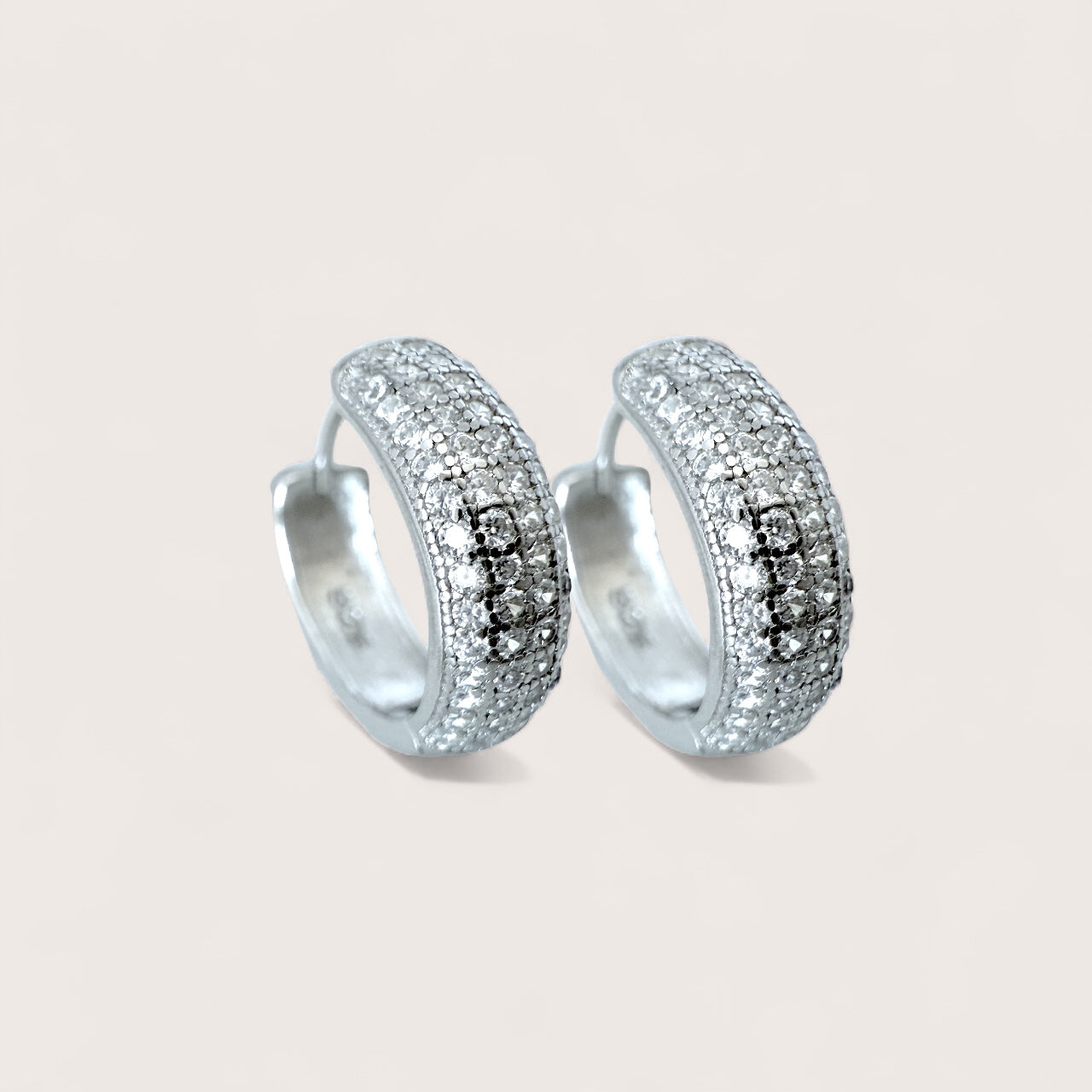 Side view of 14mm crystal pavé sterling silver hoop earrings