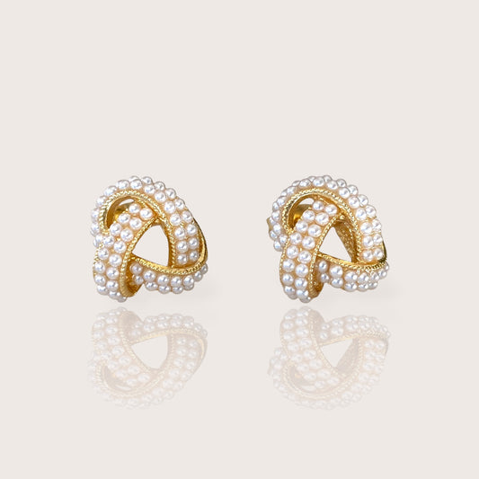 18K Gold Plated Pearl Cluster Love Knot Stud Earrings displaying the polished finish and beautiful ivory pearls.