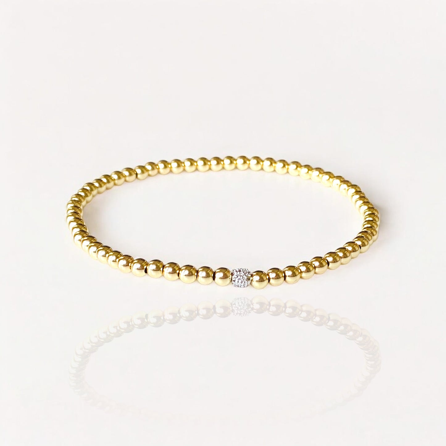 14K Gold Beaded Diamond Bead Bracelet - Solid 14K yellow gold beads in a stretchy fit bracelet. 