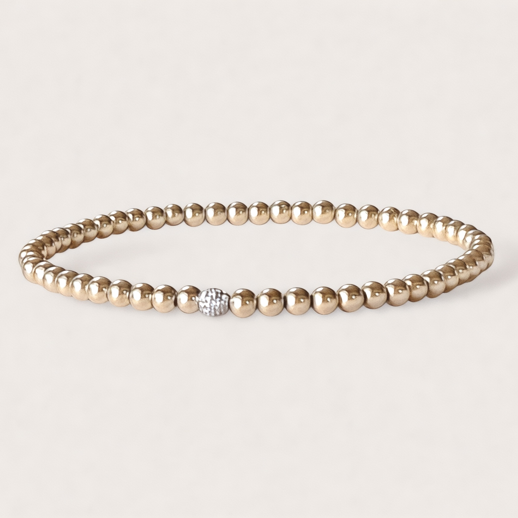 Close-up of real diamond ball accent bead in 14K gold beaded bracelet — 3mm fine jewelry by Ashley Nicole Jewelry