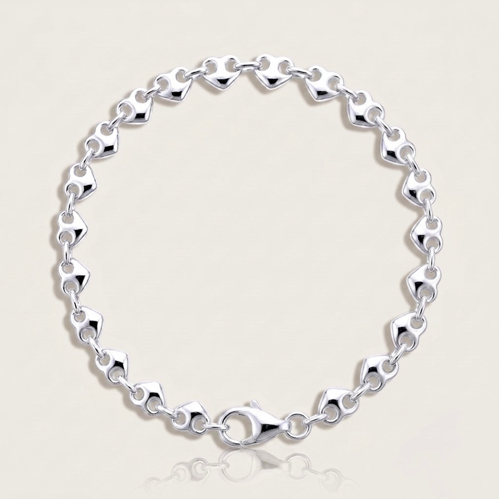 High Polish 925 solid sterling silver puffed mariner anchor chain bracelet displayed in a flat lay image by Ashley Nicole Jewelry