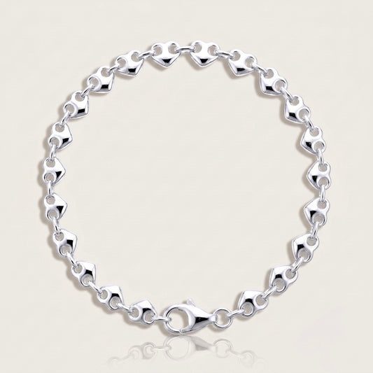 High Polish 925 solid sterling silver puffed mariner anchor chain bracelet displayed in a flat lay image by Ashley Nicole Jewelry