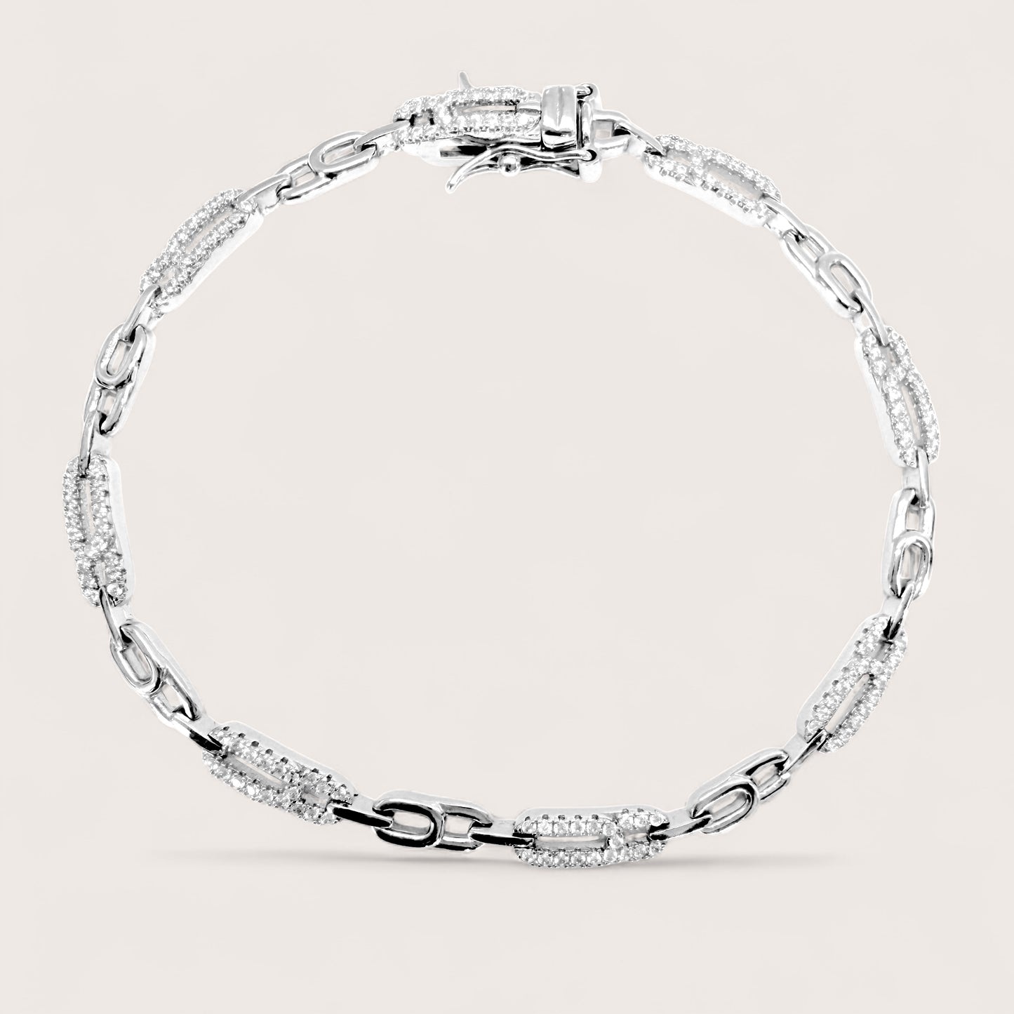 925 Silver bracelet cz paperclip link bracelet with with clear stones on a light background