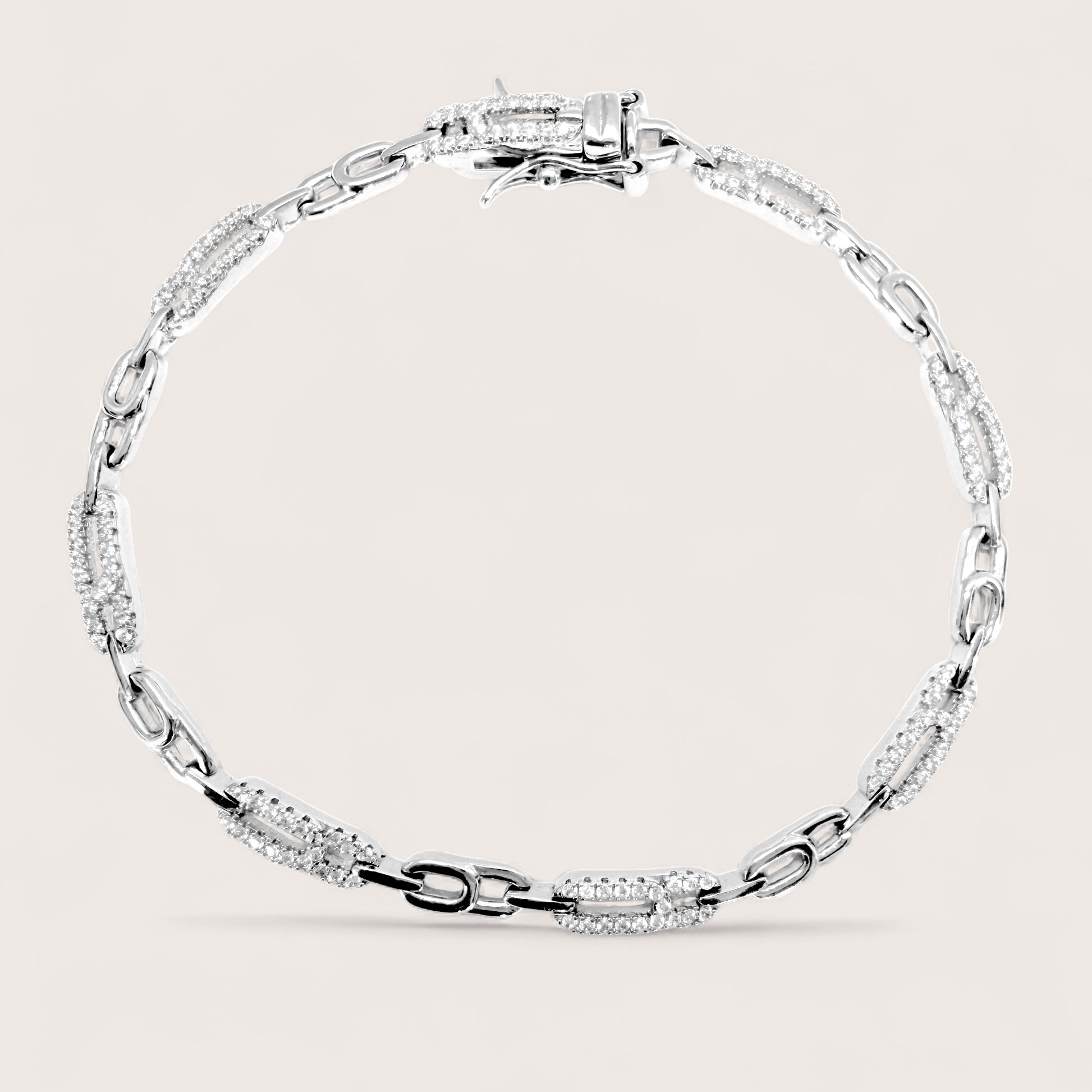 925 Silver bracelet cz paperclip link bracelet with with clear stones on a light background