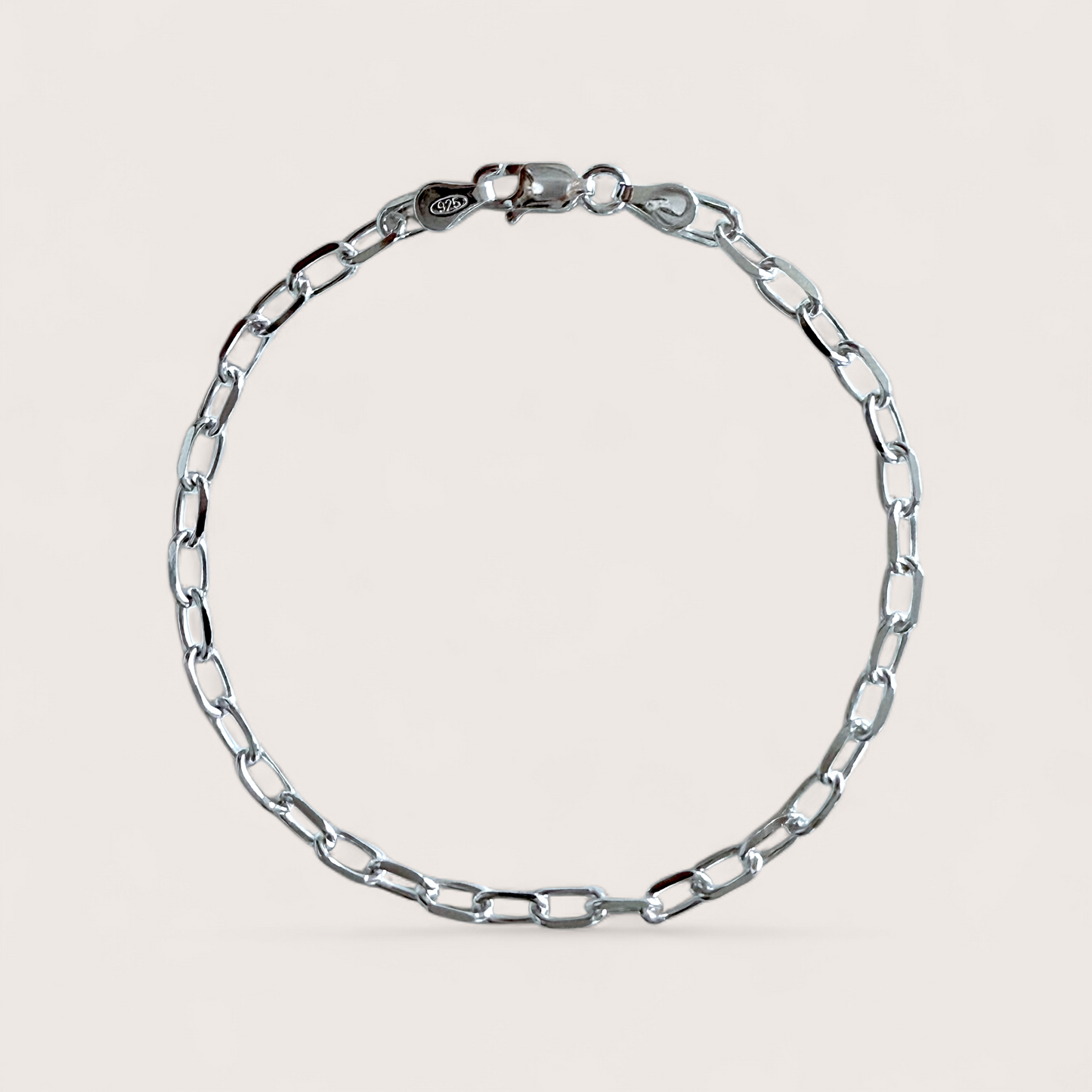 A high-polish solid 925 Italian sterling silver marina anchor link chain bracelet showing the precision diamond-cut oval links and structural center bar profile by ⁠Ashley Nicole Jewelry.