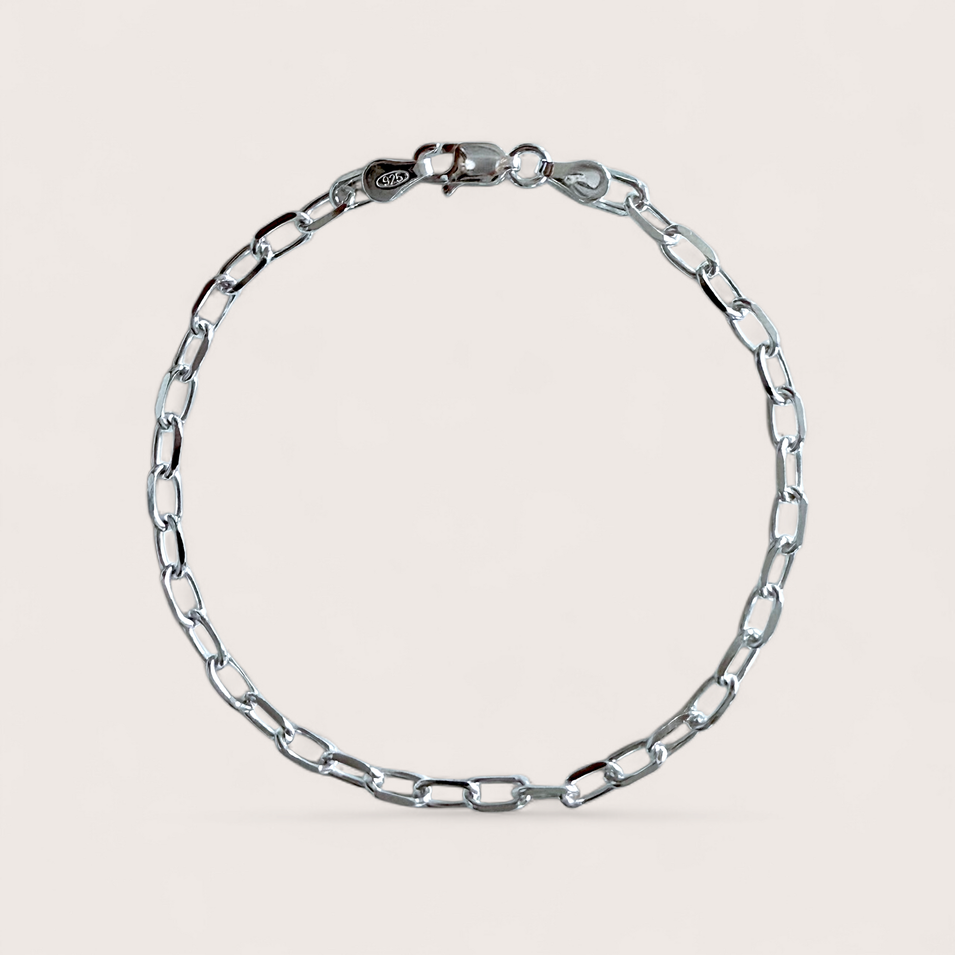 A high-polish solid 925 Italian sterling silver marina anchor link chain bracelet showing the precision diamond-cut oval links and structural center bar profile by ⁠Ashley Nicole Jewelry.
