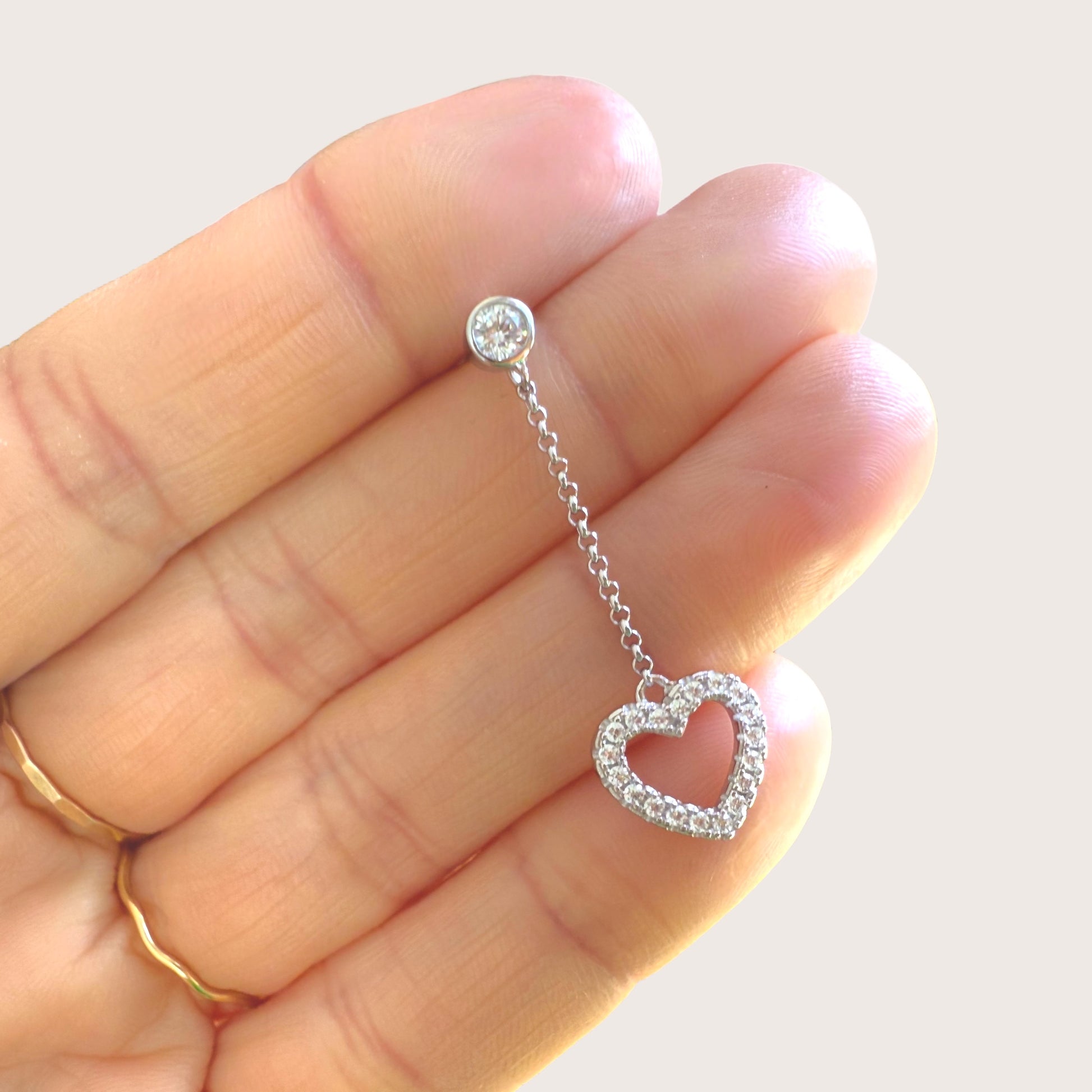 Close up of earrings in hand for size 