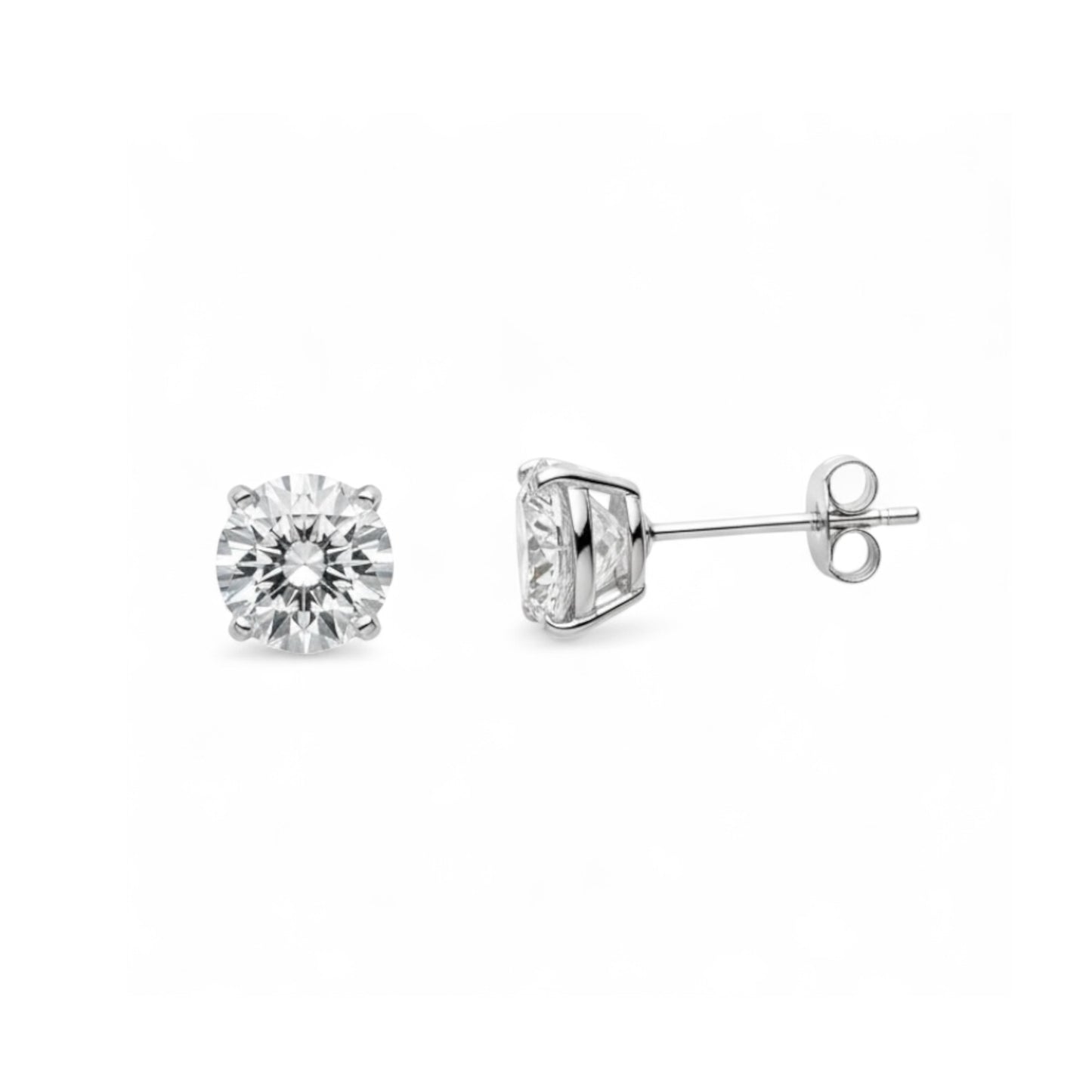 Two diamond stud earrings on a white background