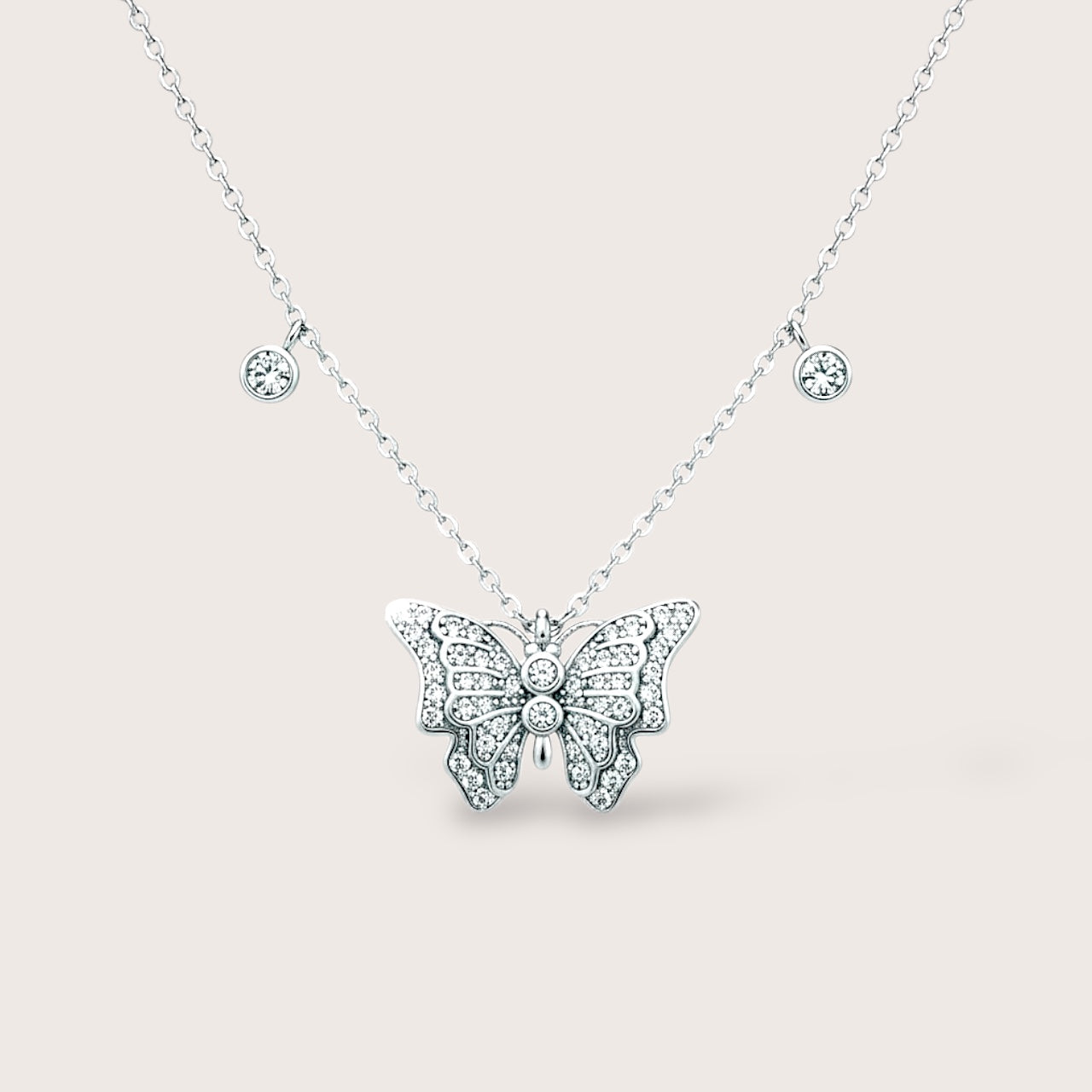 High-polish 925 sterling silver 3D butterfly pendant necklace with sparkling clear CZ accents and dangling bezel charms.