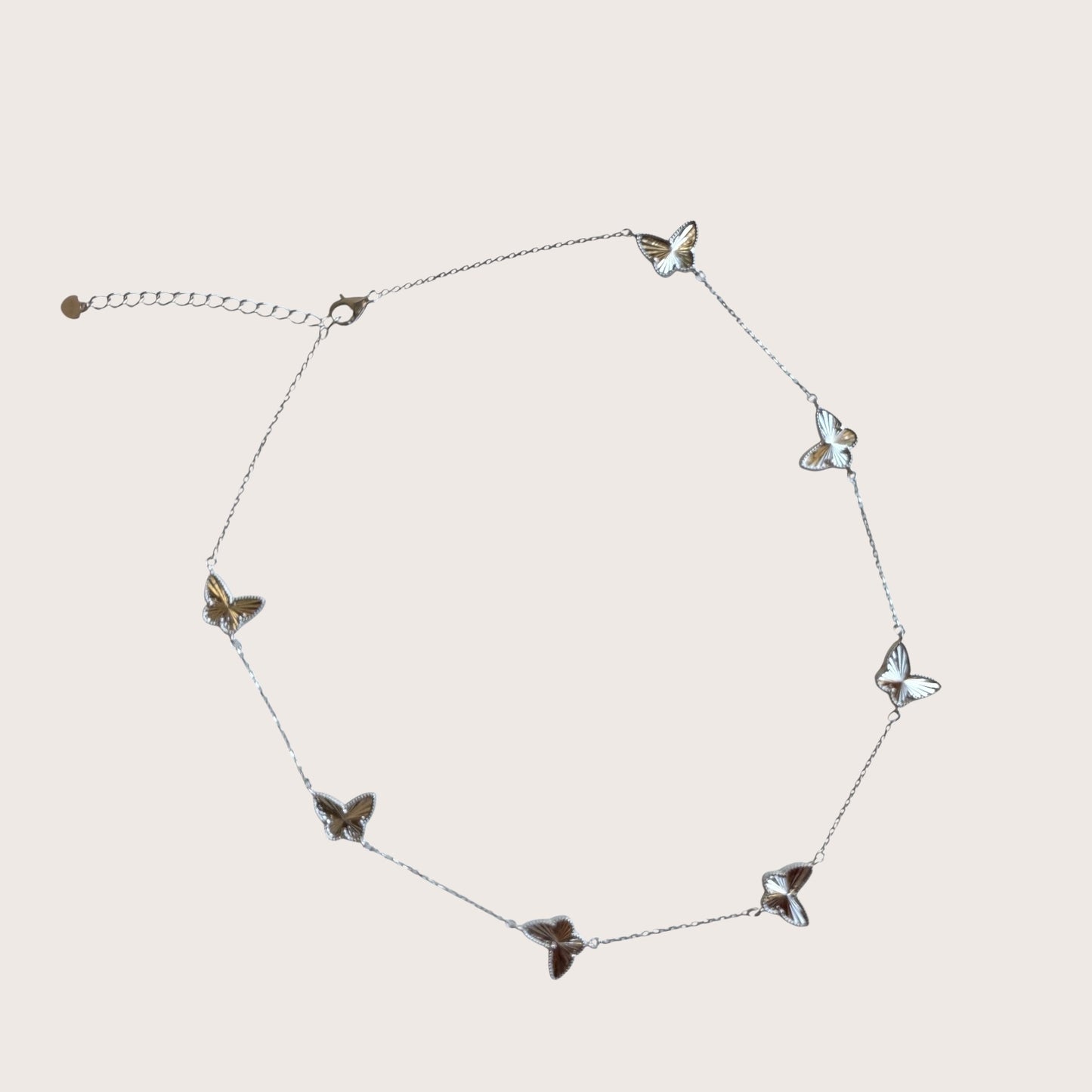 Adjustable necklace in 925 sterling silver with featuring faceted butterfly motif pendants