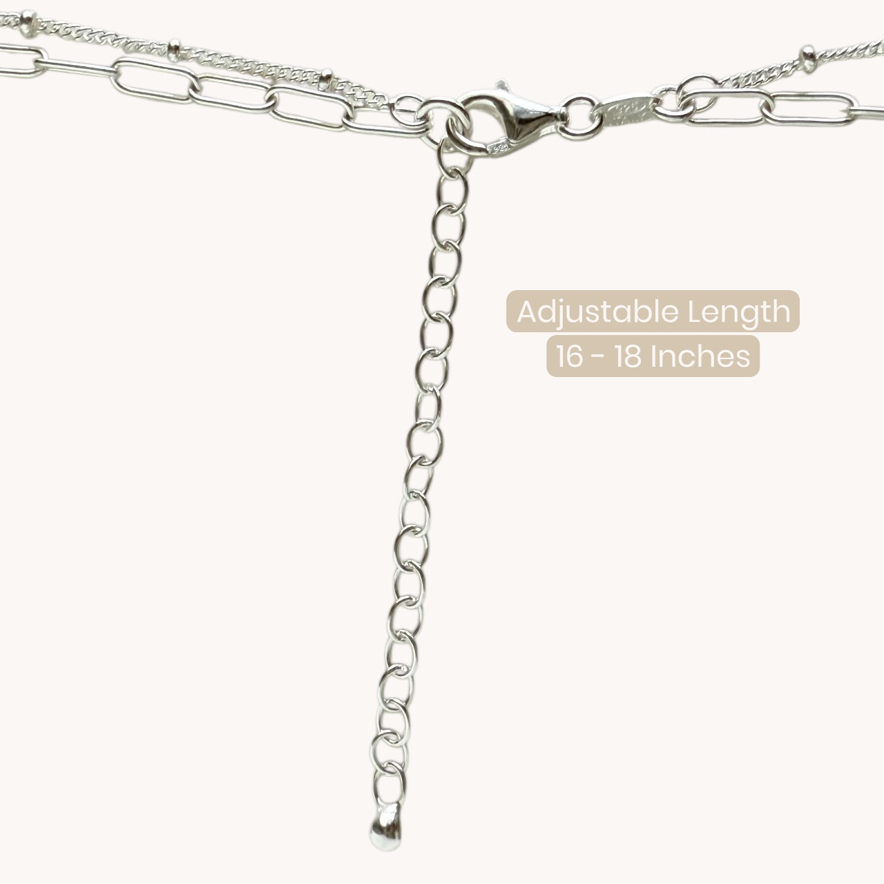 Close-up of 925 sterling silver paperclip necklace with satellite chain, adjustable length 16 inches to 18 inches and secure lobster clasp closure