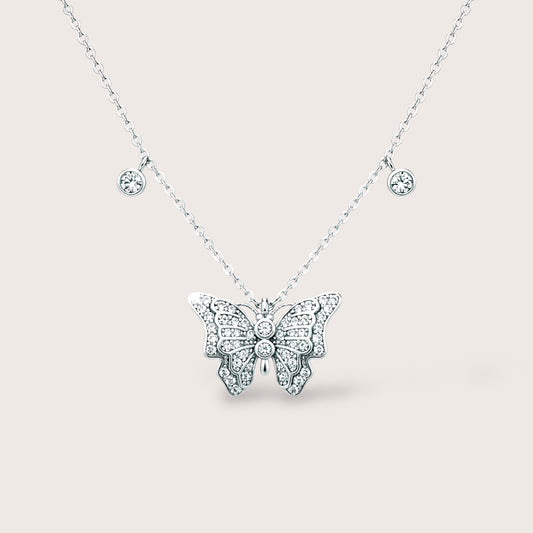 Sterling Silver Butterfly pendant necklace with diamond accents and dangling bezels.