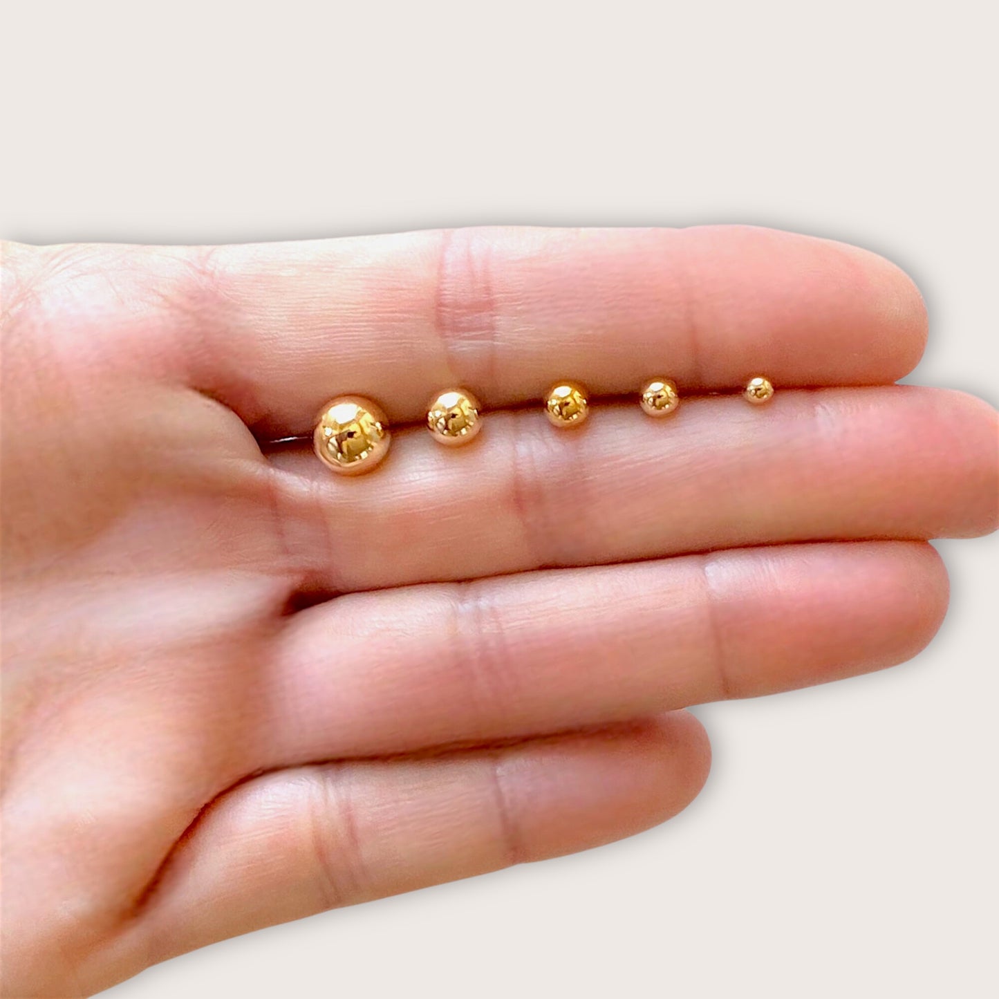 Everyday gold post earrings showing sizes 3mm -8mm 