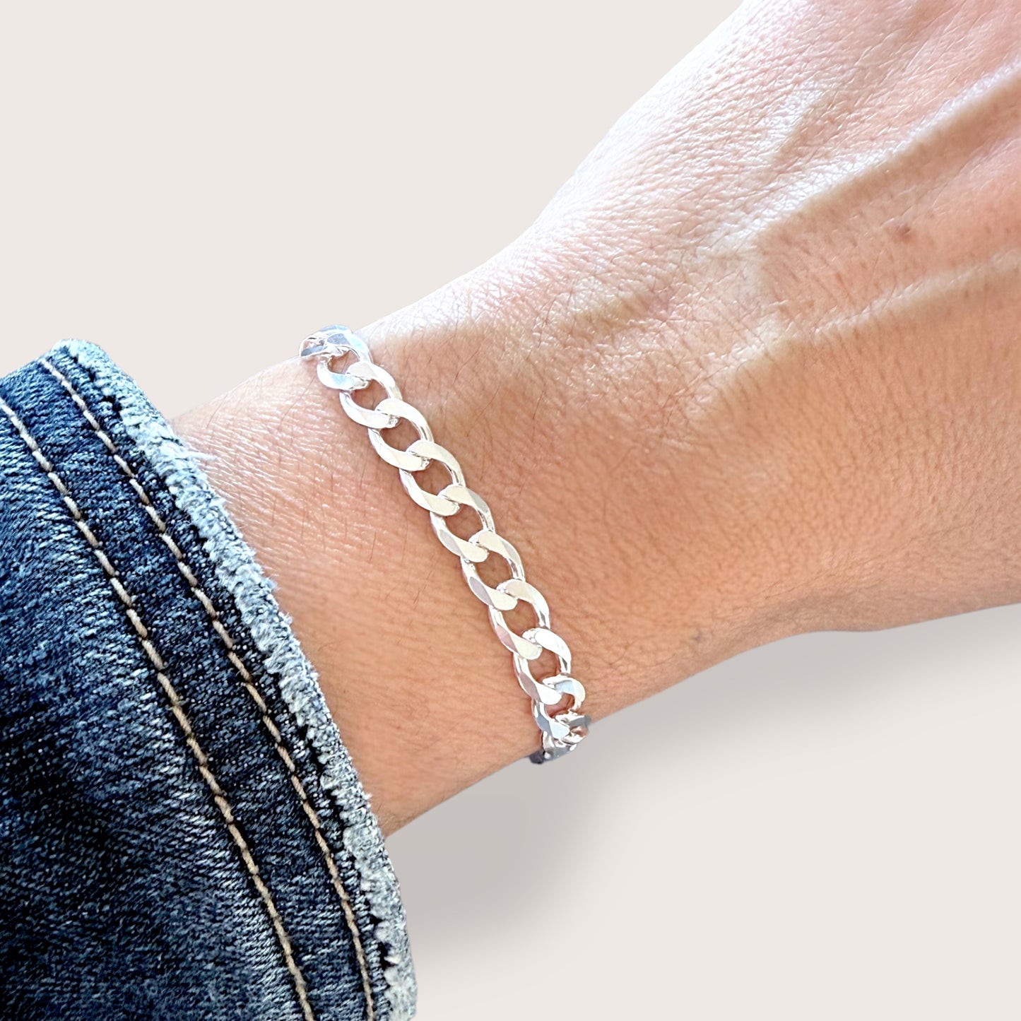 Silver Cuban Bracelet shown on model wrist in the 6mm wide chain 