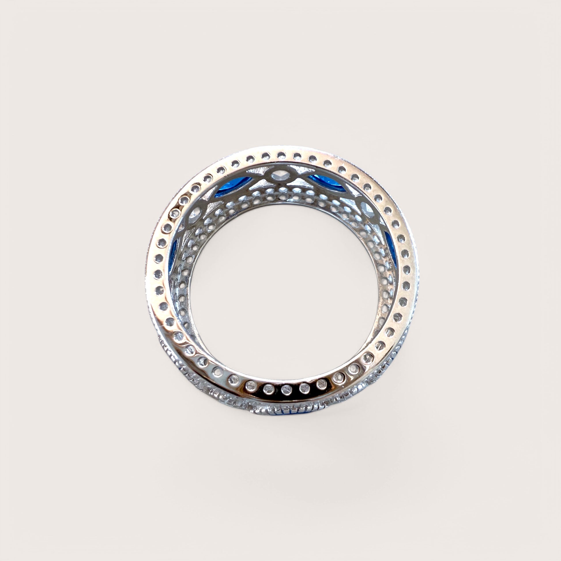 Side View of Wide 7.5mm sapphire and clear CZ gemstone band