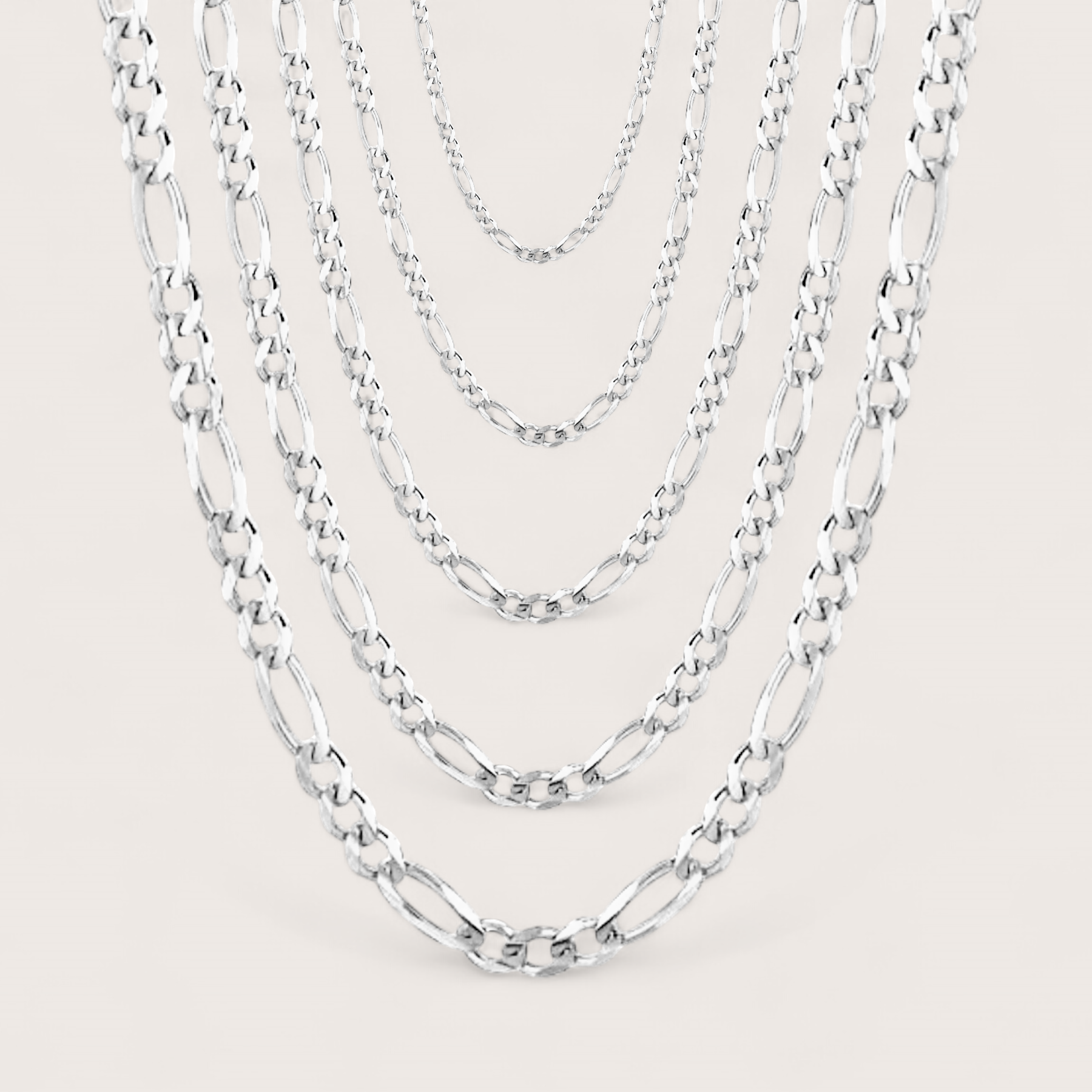 Brilliant Sterling Silver Figaro Chains for Women and Men, chain widths shown layered in width options of 1.5mm, 1.8mm, 2.3mm, 3mm, 4mm. Chains come in a variety of lengths and widths. 