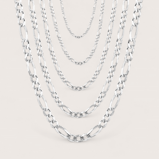 Brilliant Sterling Silver Figaro Chains for Women and Men, chain widths shown layered in width options of 1.5mm, 1.8mm, 2.3mm, 3mm, 4mm. Chains come in a variety of lengths and widths. 