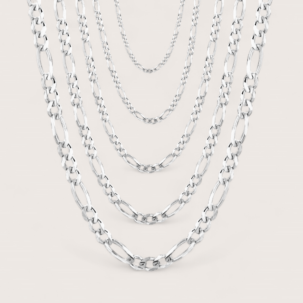 Brilliant Sterling Silver Figaro Chains for Women and Men, chain widths shown layered in width options of 1.5mm, 1.8mm, 2.3mm, 3mm, 4mm. Chains come in a variety of lengths and widths. 