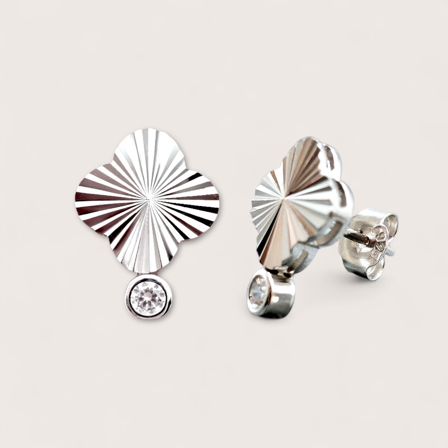 Sterling Silver stud earrings with a fluted sunburst design and a CZ drop 
