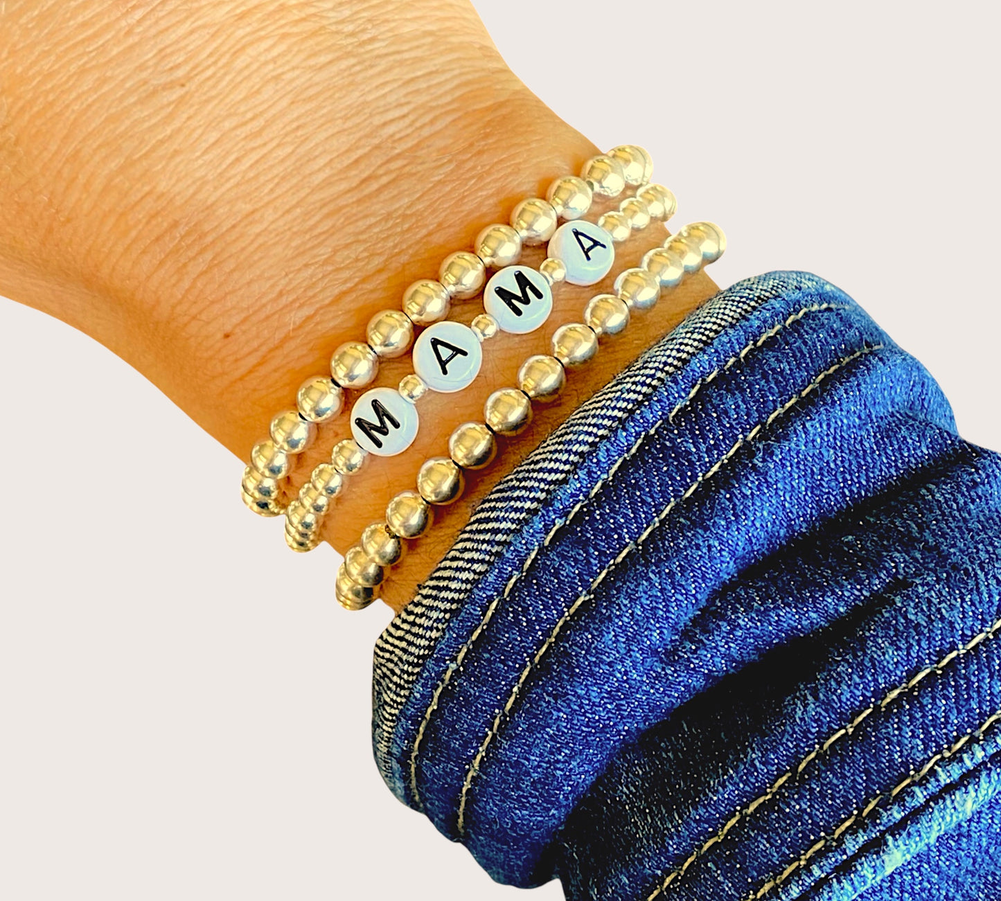 Close up of Gold Bead MAMA Bracelet on a wrist