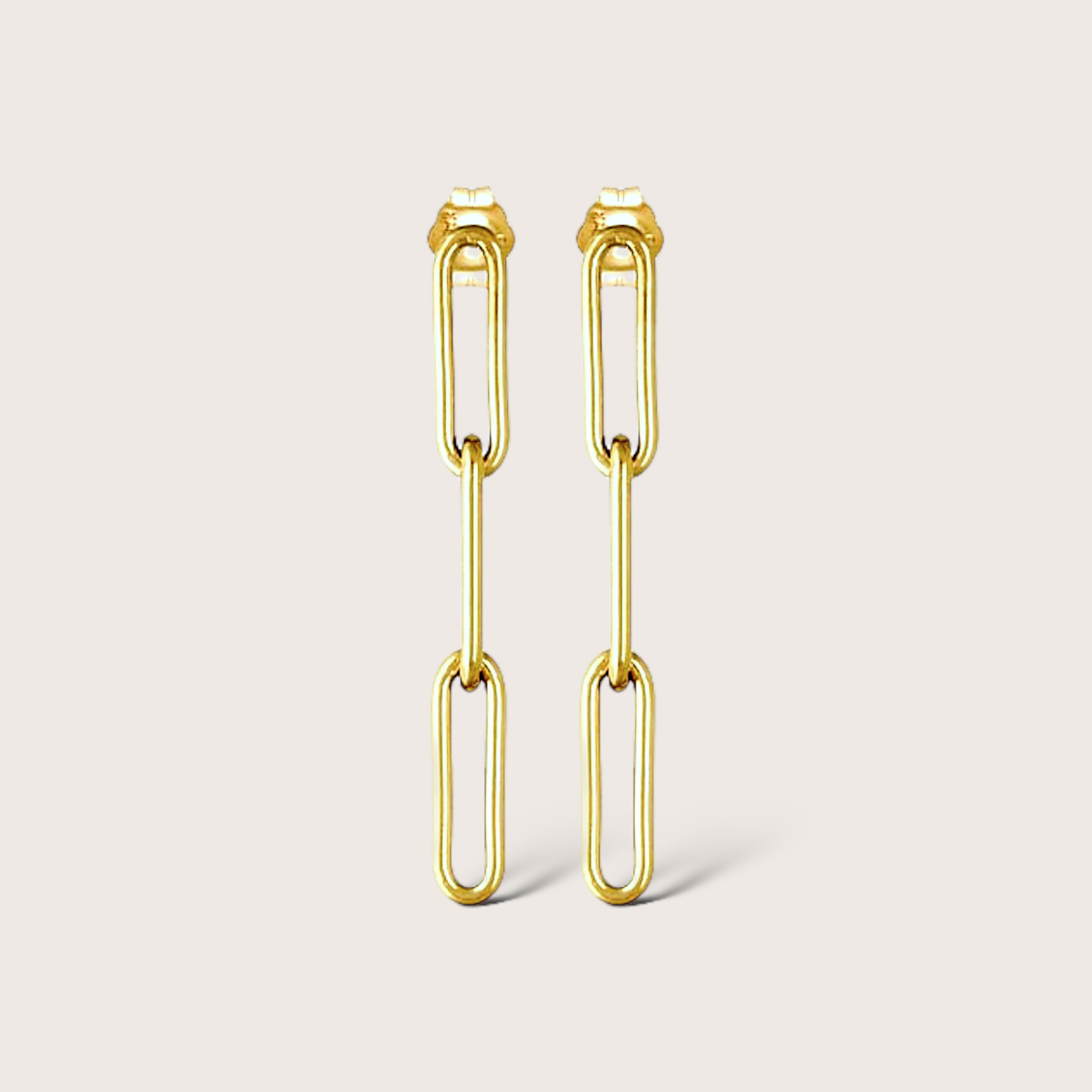 Gold filled paperclip dangle earrings with 1.5” drop on white background