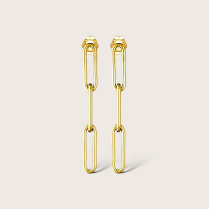 Gold filled paperclip dangle earrings with 1.5” drop on white background
