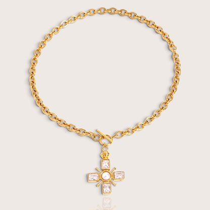 Full layout studio view of the gold cable chain necklace with the Maltese cross pendant and front toggle clasp centered.
