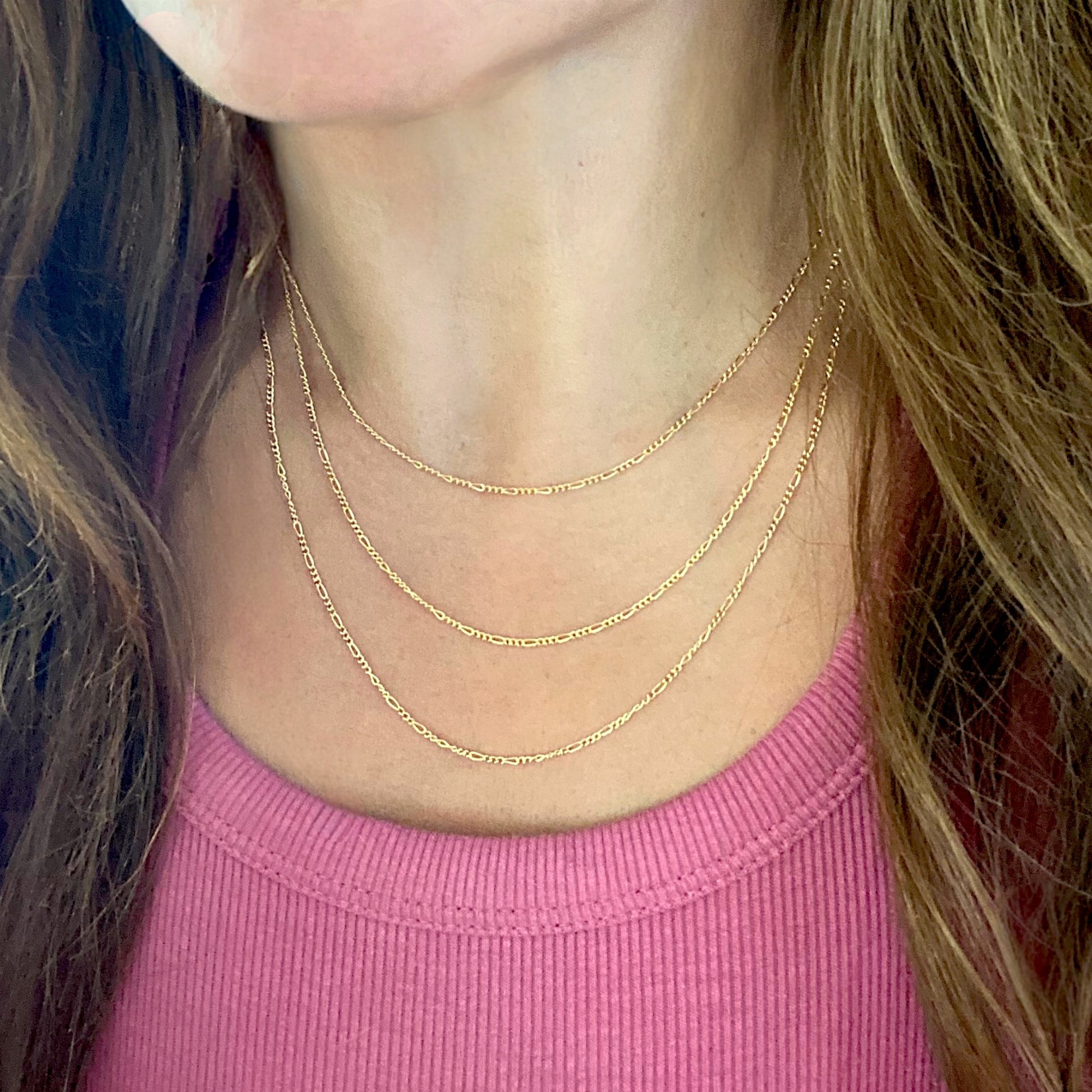 Model wearing necklaces for length visual