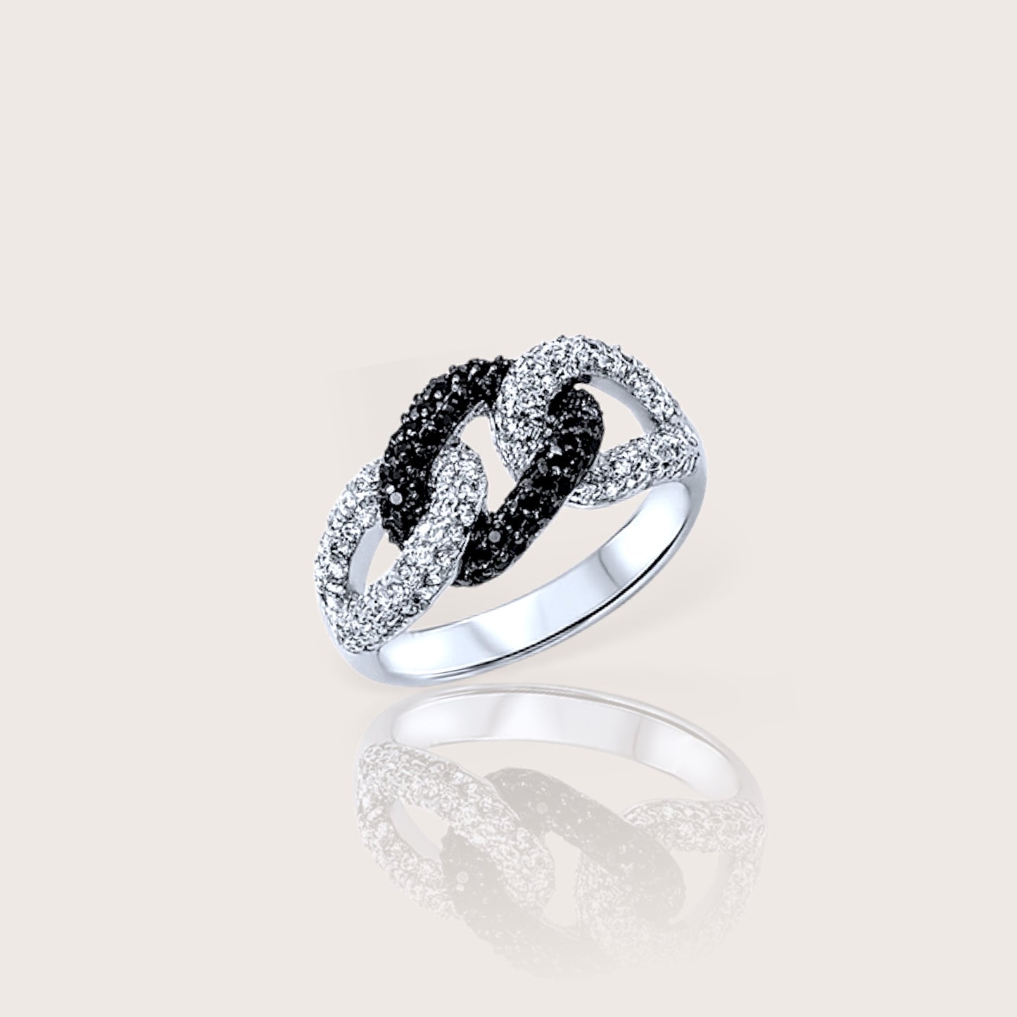 A silver ring with black and clear cubic zirconia stones set in a twisted band design.