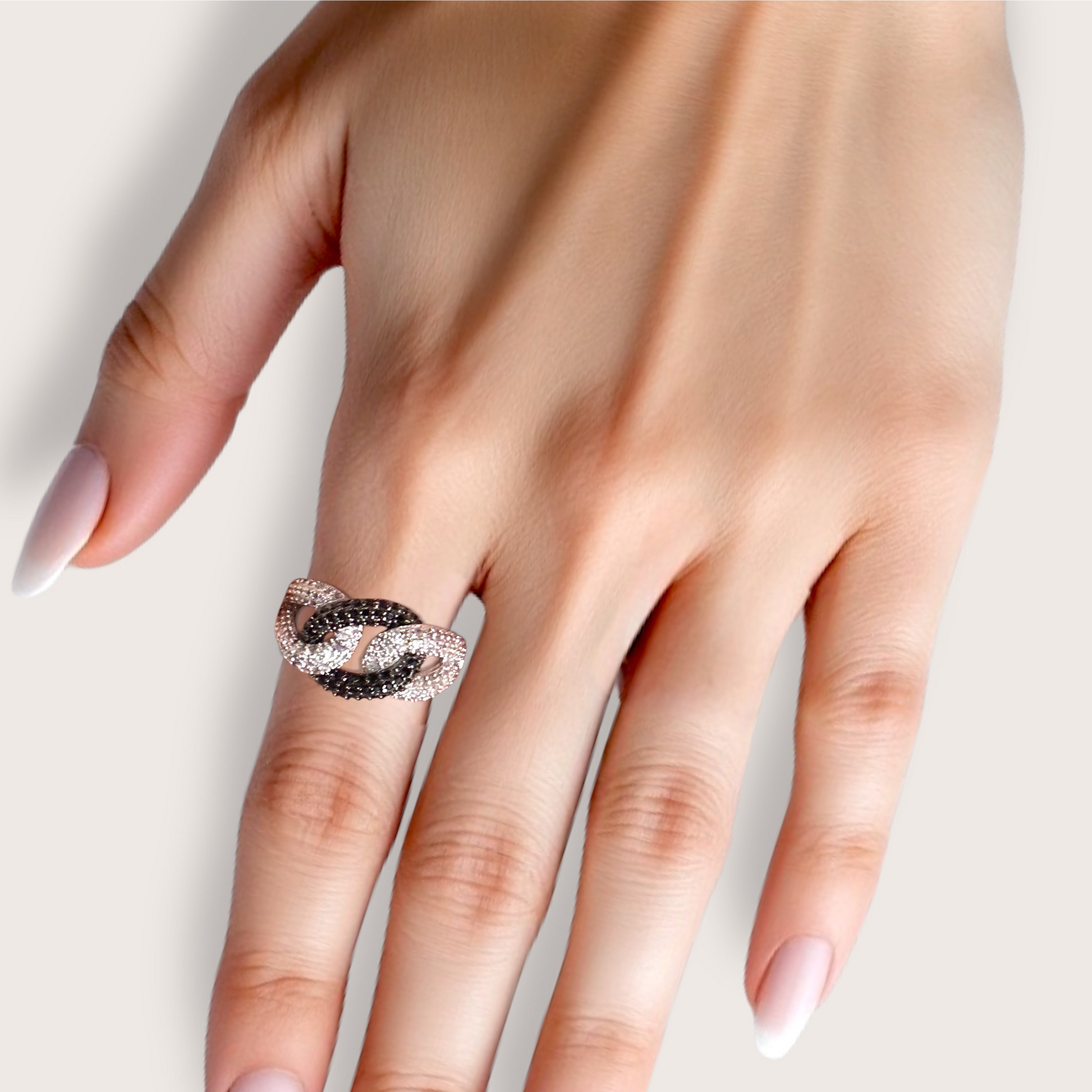 Model wearing 925 Sterling Silver Interlocking chain link rings with , black and clear CZ Stones 