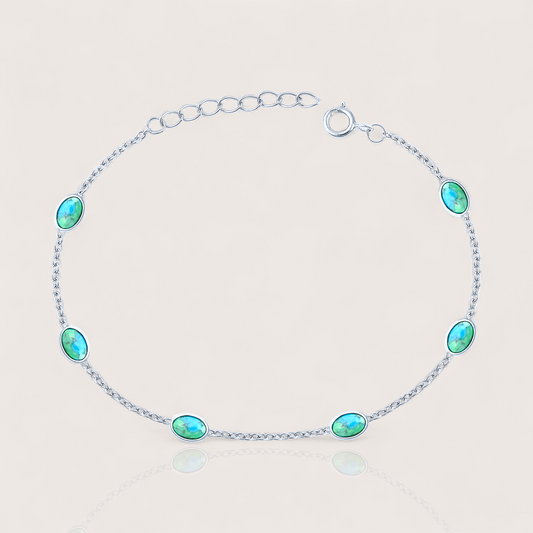 Close-up of sterling silver turquoise station bracelet with 6 oval turquoise stones