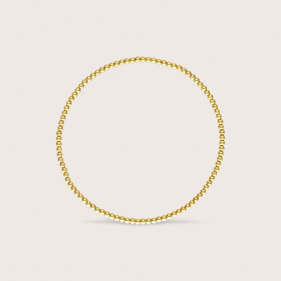 Give your little one the gift of style with our dainty 2mm Gold Bead Baby Bracelet. These custom-sized bracelets are made with high-quality, hypoallergenic materials, ensuring that they are safe for sensitive skin. Plus, the non-tarnishing gold beads and stretch fit make it easy to put on and take off. Ethically sourced and tested for quality, your baby will be the trendiest kid on the block.*

