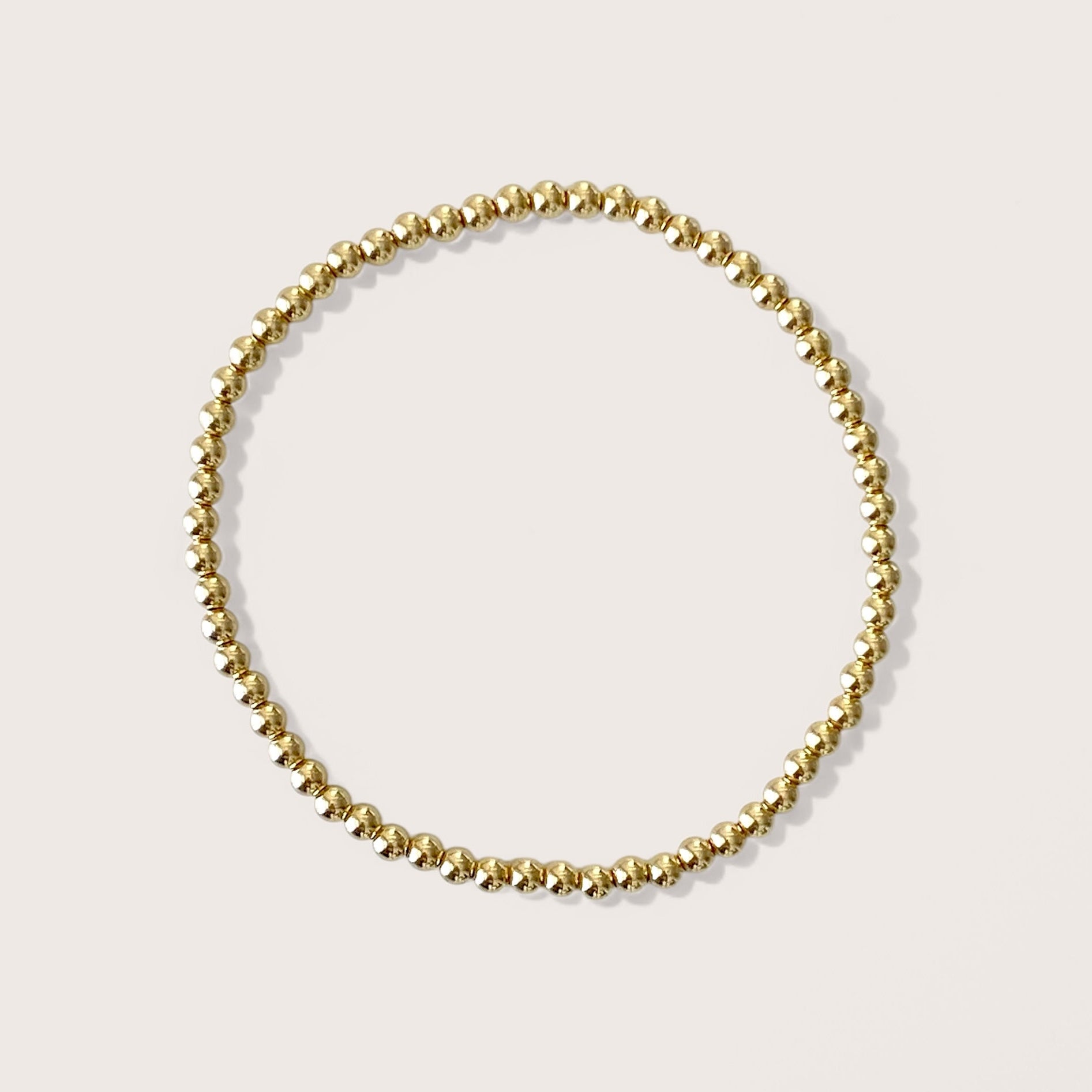 3mm Gold Beaded Bracelets, handcrafted with premium 14K yellow gold-filled beads that are water-resistant and tarnish-proof, effortlessly add sophistication to any outfit. Ideal for stacking and layering, these bracelets are the ultimate choice for chic accessorizing.