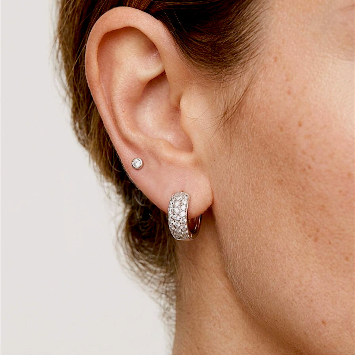 Sterling silver pavé huggie earrings styled on model