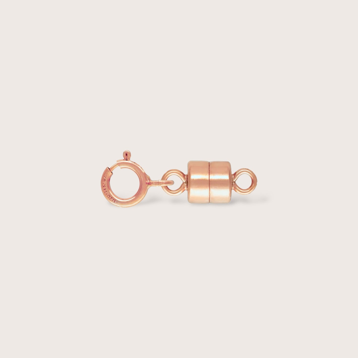 close-up highlighting 14K Rose Gold Filled metal quality stamps on the secure, high-polish magnetic closure converters.