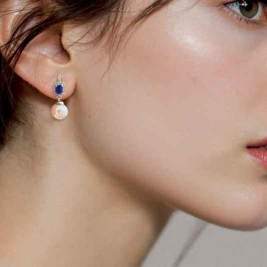 Model wearing Sterling Silver Drop Sapphire Pearl Earrings