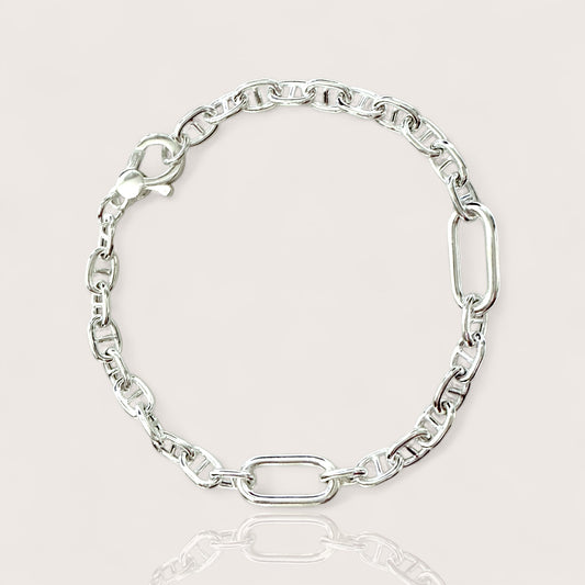 A sterling silver anchor mariner link chain bracelet with a lobster clasp closure.