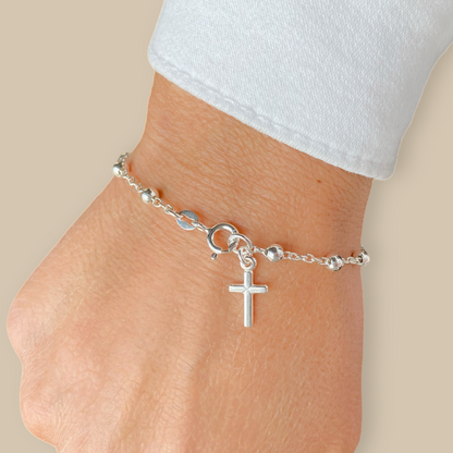 Close up of solid 925 sterling silver rosary bracelet on a persons wrist