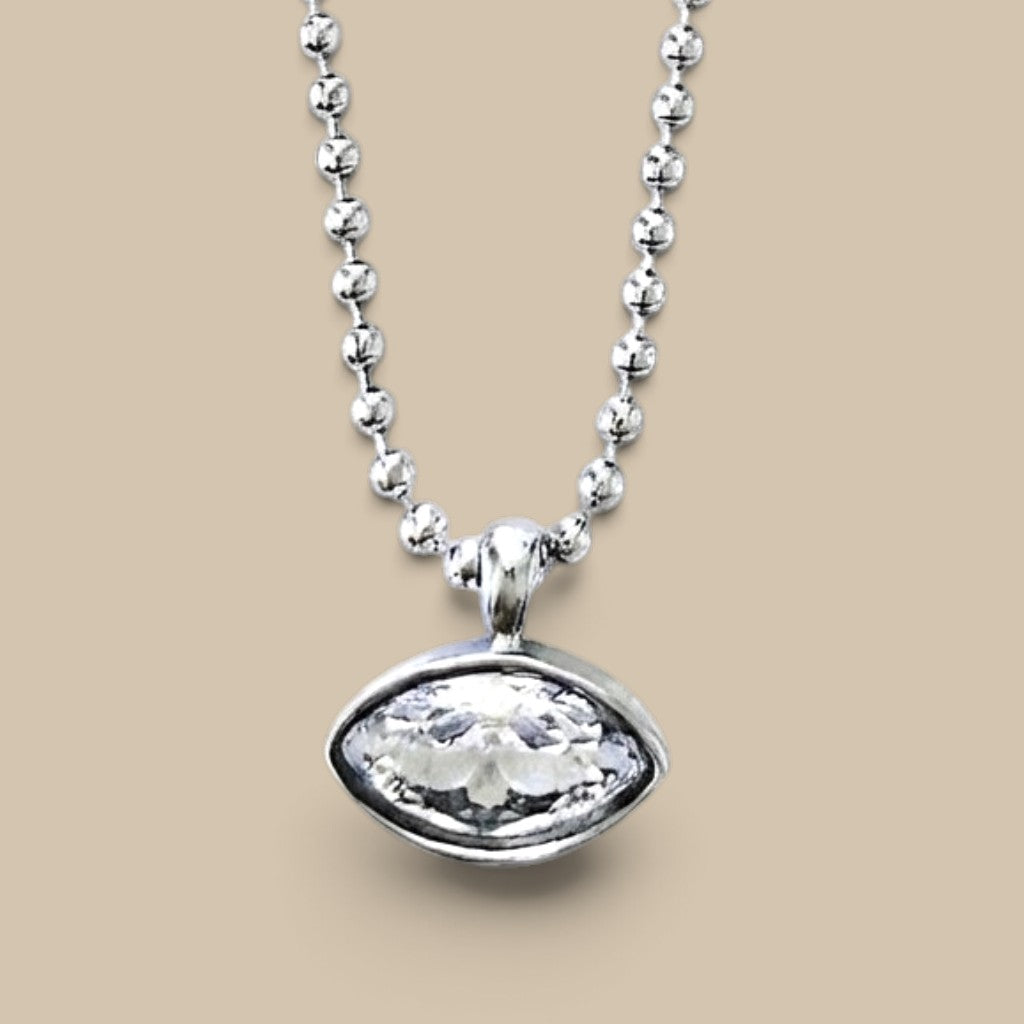 Close up view of the marquise bezel pendant necklace in silver stainless steel
