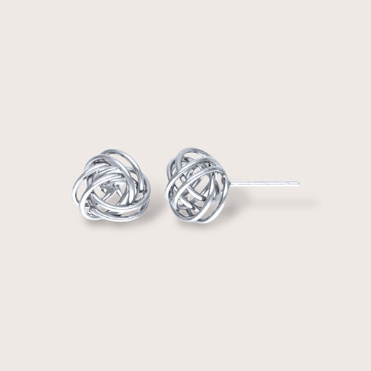 Close up of a pair of sterling silver love knot earrings - showing front facing and side angles.