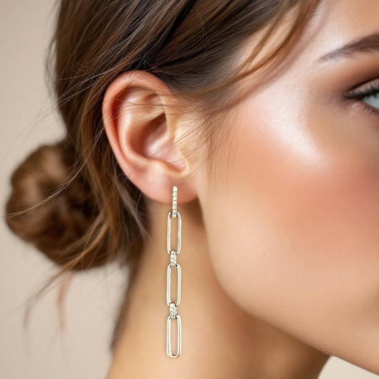 model wearing Silver Paperclip Chain Dangle Drop Earrings with sparkling CZ links