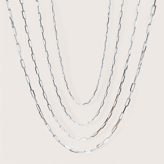 Side by Side of Solid 925 Italain Sterling Silver Paperclip Chain Necklaces for Men & Women. Chains are layered  showing virus width and length options. 