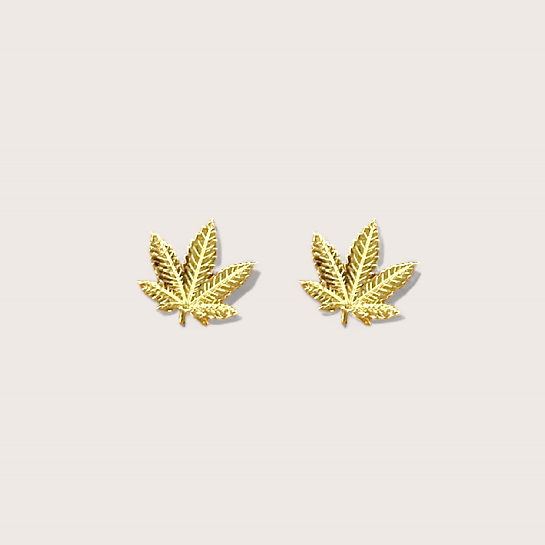 Dainty 14K Yellow Gold Cannabis Leaf Stud Earrings Front view of 7.5mm