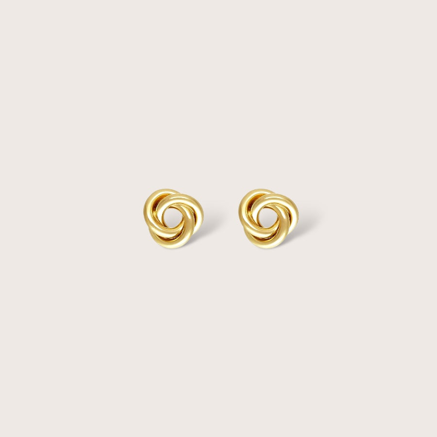 Detailed close-up of a tarnish resistant, hypoallergenic 14K gold filled knot earring showing the secure push back butterfly closure for kids.