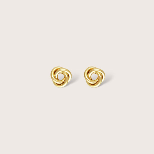 Detailed close-up of a tarnish resistant, hypoallergenic 14K gold filled knot earring showing the secure push back butterfly closure for kids.