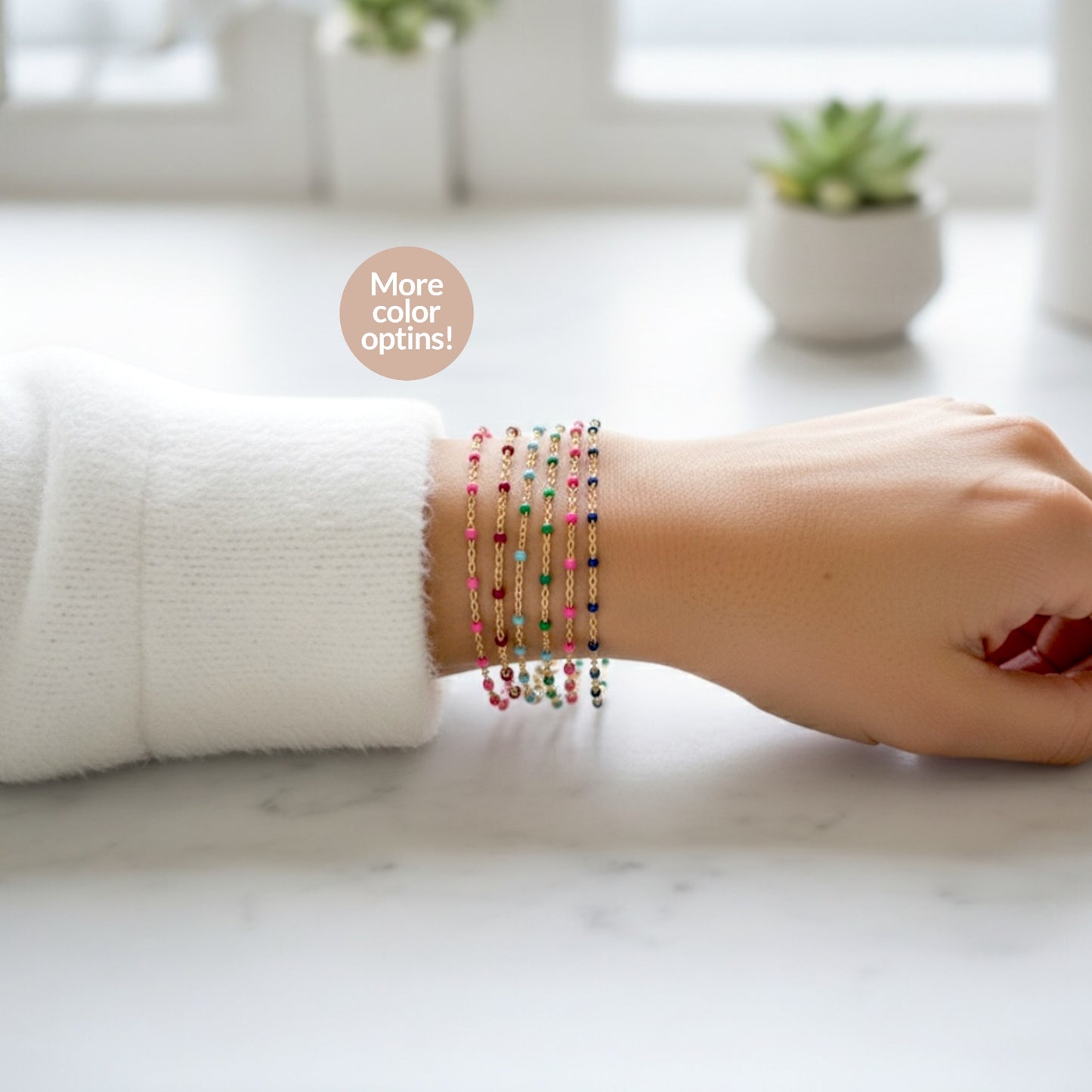 Stacked Multicolored beaded station bracelet on a wrist - showing color options