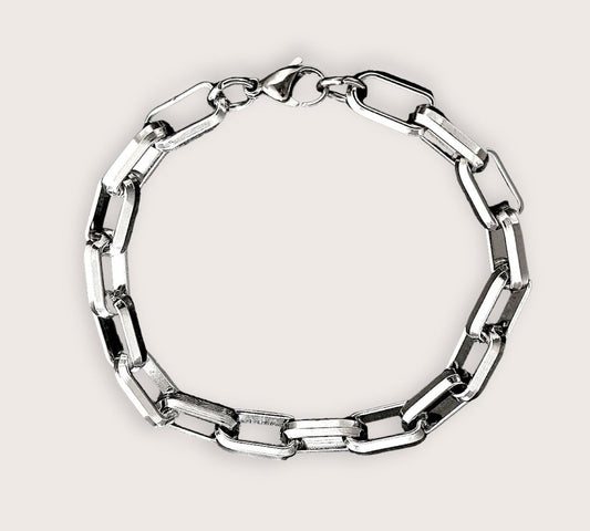 A stainless steel bracelet with a robust and sophisticated design, featuring a series of interlinked metal rings.