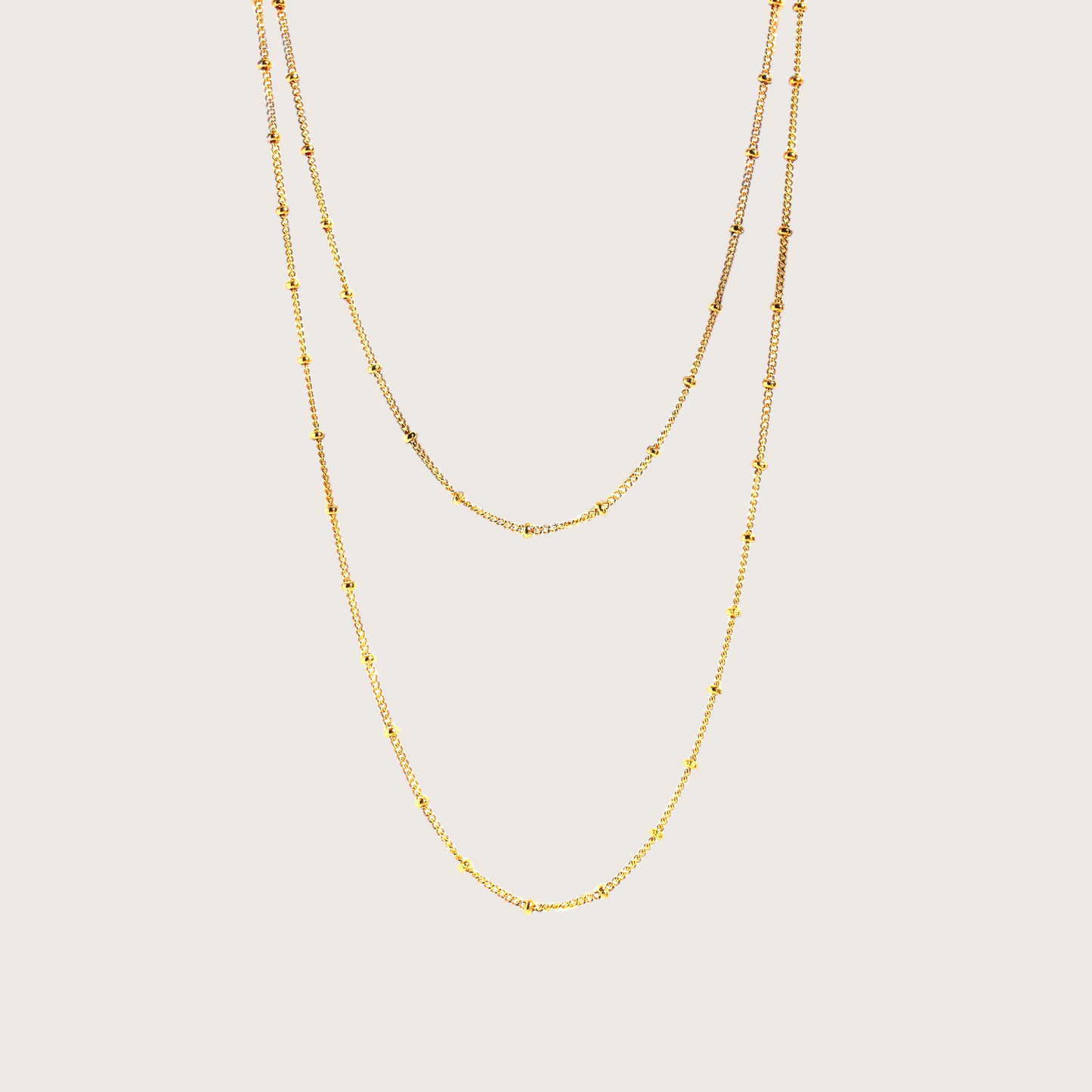 Discover a new level of elegance with our Gold Station Bead Chain Necklace. This stunning piece features a delicate design with dainty beads evenly spaced out that adds a touch of sophistication to any outfit. Crafted with high-quality materials, it's the perfect accessory for any occasion.&nbsp;
