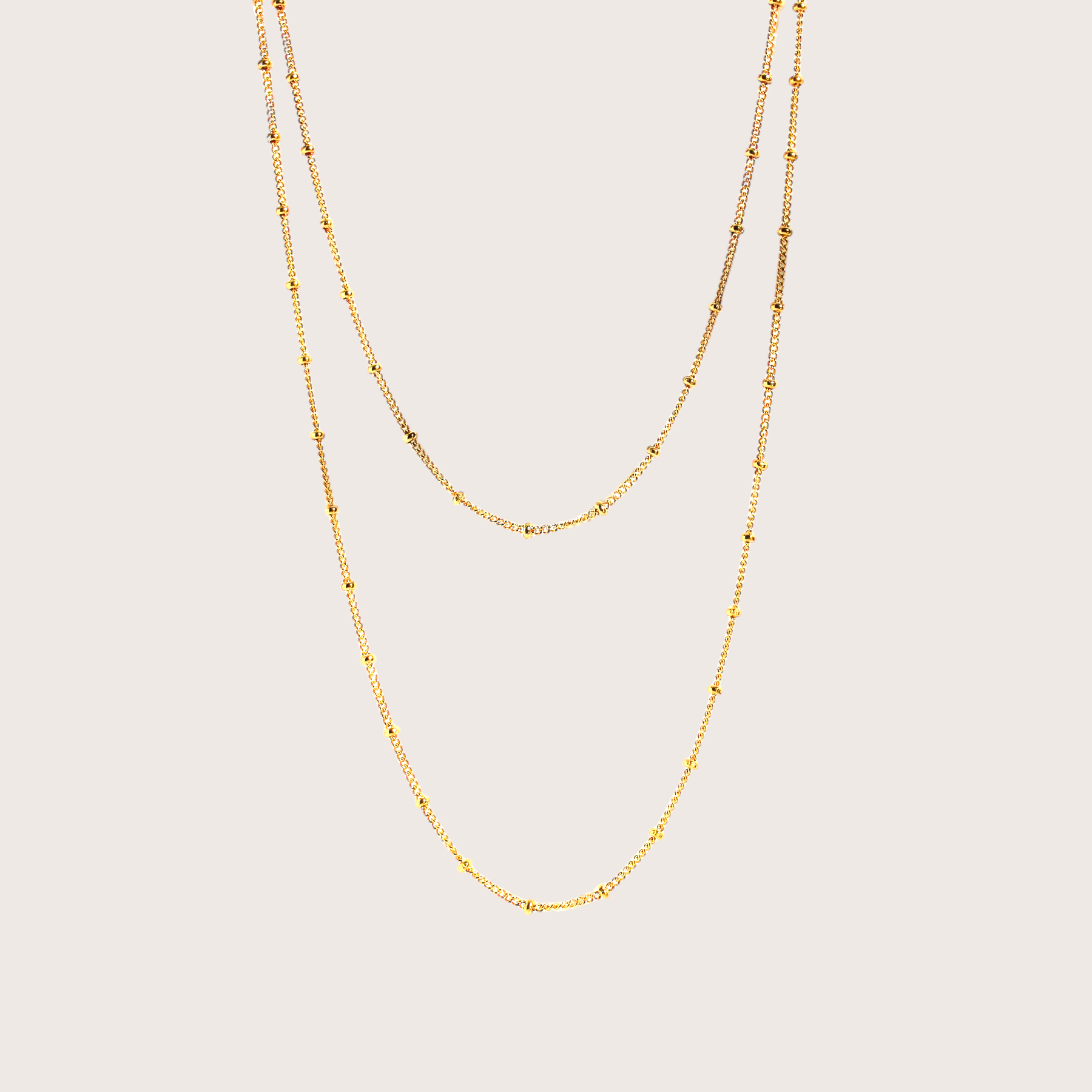 Discover a new level of elegance with our Gold Station Bead Chain Necklace. This stunning piece features a delicate design with dainty beads evenly spaced out that adds a touch of sophistication to any outfit. Crafted with high-quality materials, it's the perfect accessory for any occasion.&nbsp;