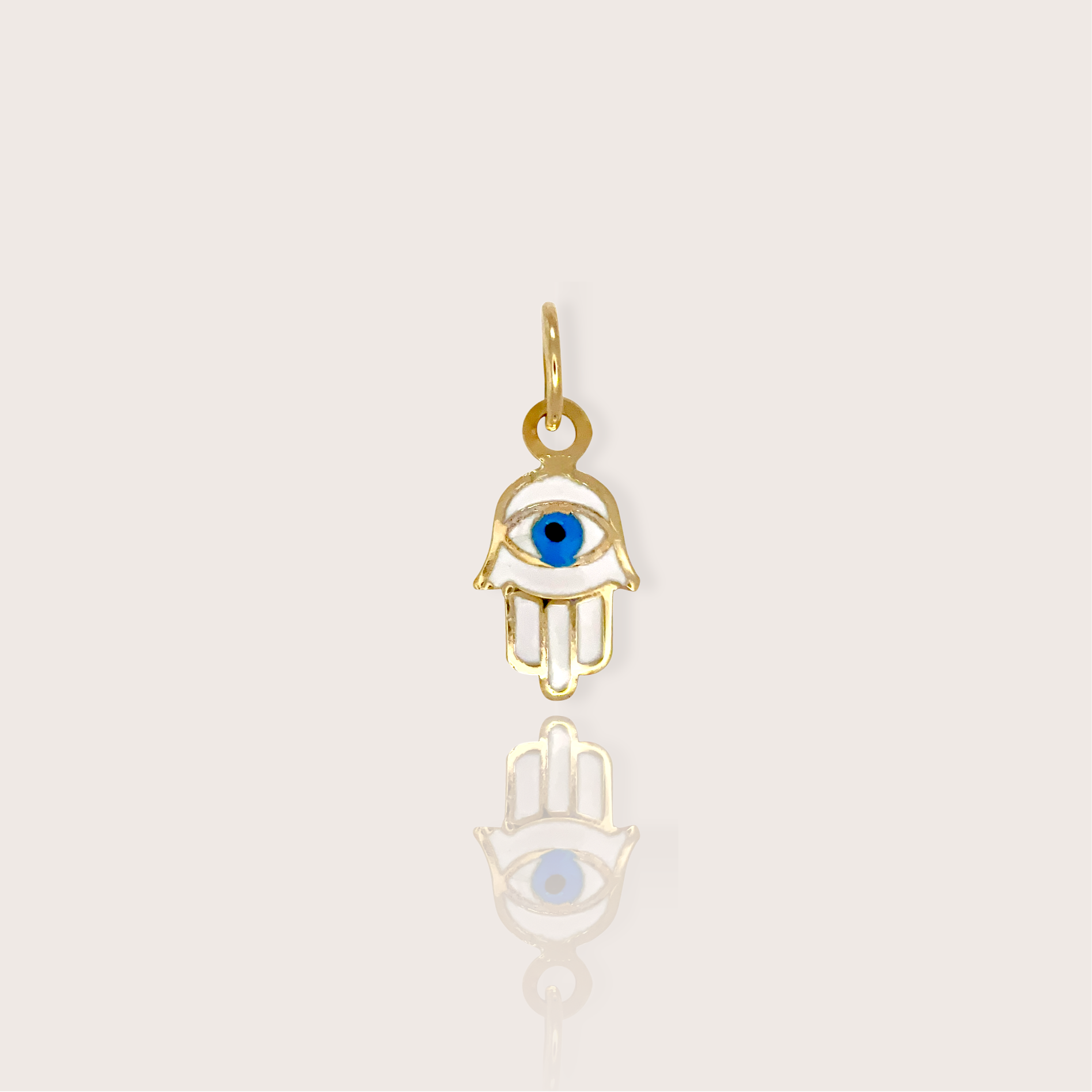 Elegance and protection with our Tiny 14K Yellow Gold Hamsa Hand Charm. Measuring 8x6mm, this dainty pendant features an intricate white and blue enamel detailing, representing the traditional Hamsa symbol known for its protective qualities.